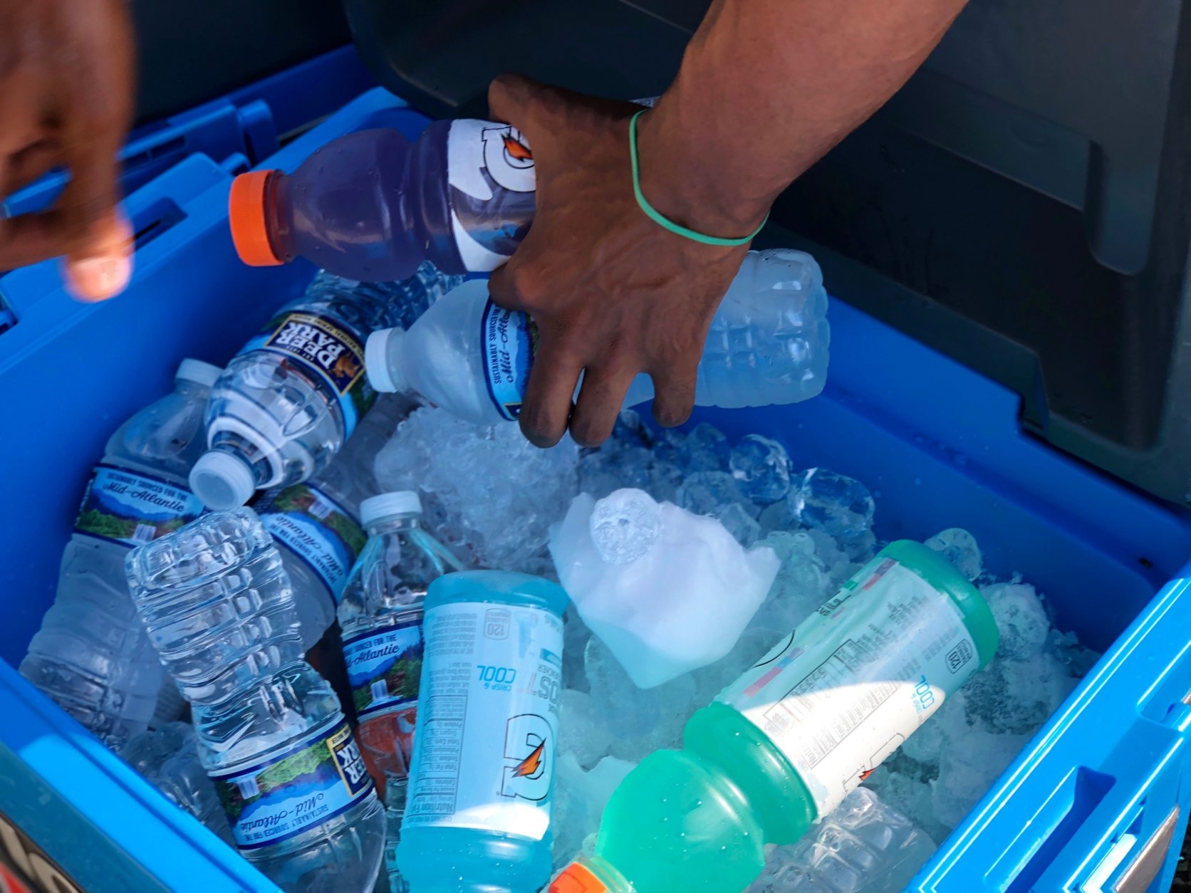 The National Park Service has a contract with a company that sells food and beverages at the 9 kiosks on the Mall. Selling out of a cooler like Dani and many others do, is illegal. Dani says he's been arrested before, but the money's so good, it's worth the risk. (WTOP/Kate Ryan)