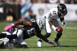 OAKLAND, CA - OCTOBER 08:  Jimmy Smith #22 of the Baltimore Ravens returns a recovered fumble by Jared Cook #87 of the Oakland Raiders for a touchdown during their NFL game at Oakland-Alameda County Coliseum on October 8, 2017 in Oakland, California.  (Photo by Thearon W. Henderson/Getty Images)