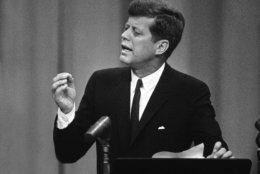U.S. President John F. Kennedy gestures during a news conference in the State Department auditorium in Washington, August 10, 1961. A record number of newsmen?attended. The chief executive said border patrolmen will be assigned to some airplane to guard against hijacking. The United States space program and operation of the presidency if Kennedy should become incapacitated also are discussed. (AP Photo)