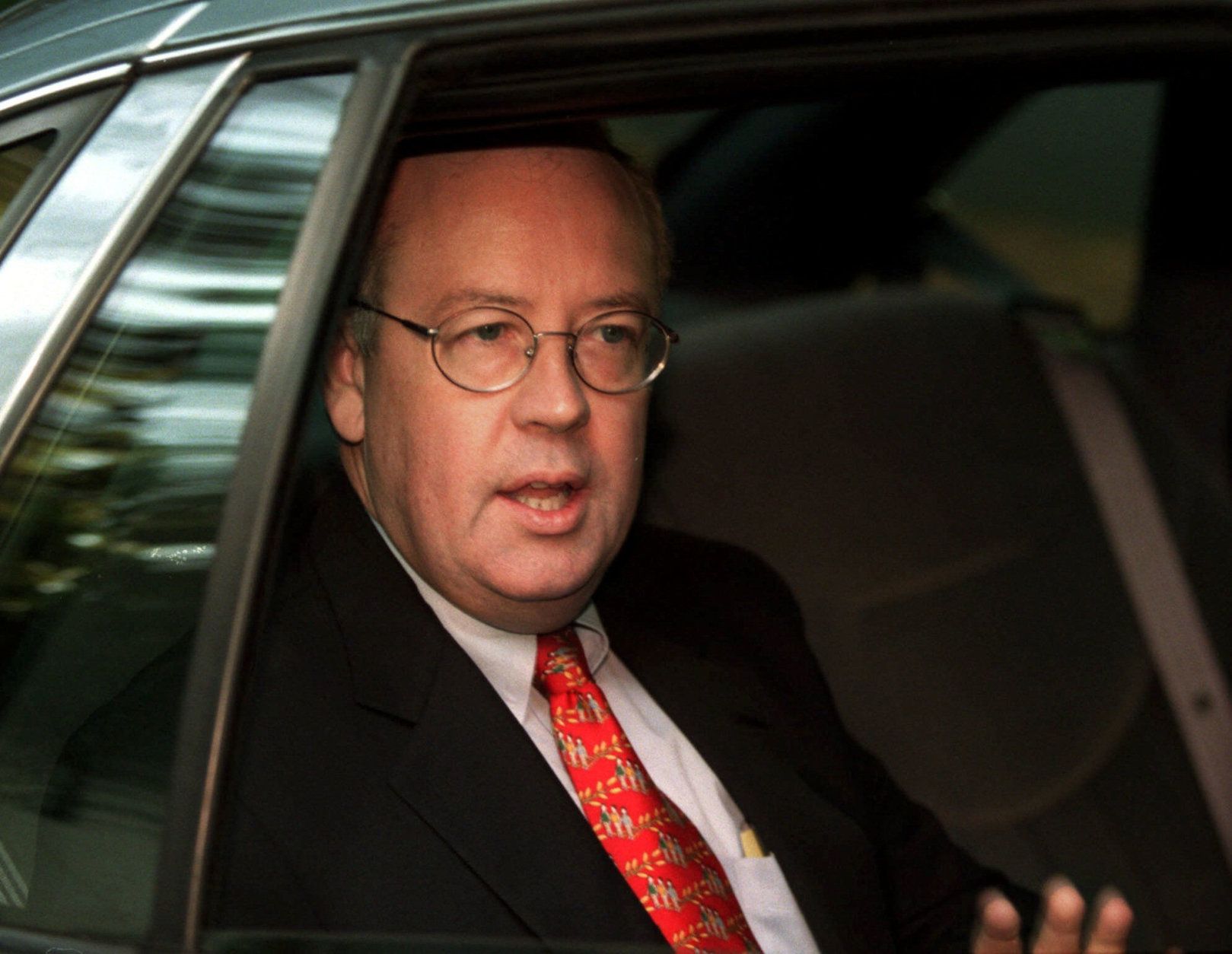 Independent Counsel Kenneth Starr departs his home by car Thursday morning, Sept. 10, 1998, in McLean, Va. The 445-page Starr report on the investigation into the affair between President Clinton and former White House intern Monica Lewinsky was delivered to Congress Wednesday afternoon. (AP Photo/Khue Bui)