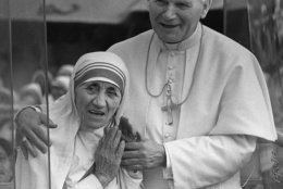 FILE--Pope John Paul II has his arms around Mother Teresa as they greet the faithful in the Popemobile Feb. 3, 1986, just outside the Home for the Dying in Calcutta, India. The Roman Catholic nun whose very name became synonymous with charity for her work with  the poorest of the poor,  has died. She was 87. (AP Photo)