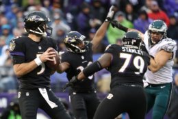 BALTIMORE, MD - DECEMBER 18: Quarterback Joe Flacco #5 of the Baltimore Ravens drops back to pass while teammate offensive tackle Ronnie Stanley #79 blocks against  cornerback Dwayne Gratz #36 of the Philadelphia Eagles in the second quarter at M&amp;T Bank Stadium on December 18, 2016 in Baltimore, Maryland. (Photo by Rob Carr/Getty Images)