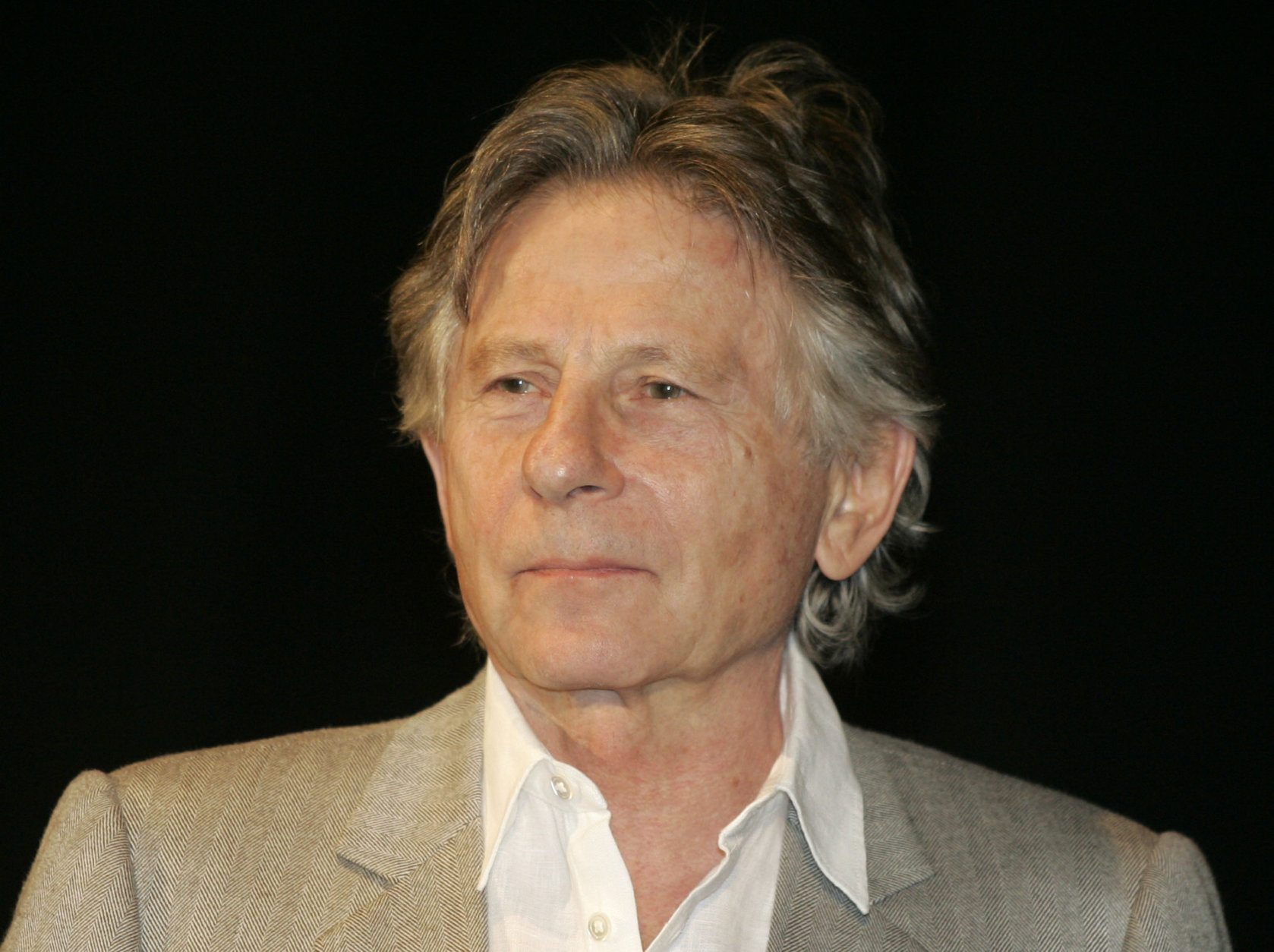 ** FILE ** In this Monday, Sept. 29, 2008 file photo Polish director Roman Polanski is seen in Oberhausen, western Germany. Organizers of the Zurich Film Festival say director Roman Polanski has been taken into custody on a 31-year-old U.S. arrest warrant. The organizers say Polanski was detained by police Saturday Sept. 26, 2009. (AP Photo/Roberto Pfeil, File)