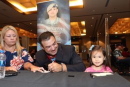 Congressional Medal of Honor recipient Leroy Petry autographs for a youngster. (Courtesy Shmulik Almany/Congressional Medal of Honor Society)