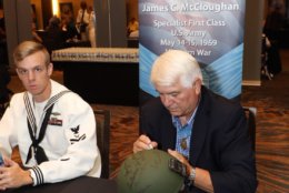 Medal of Honor recipient James McCloughan with an admirer from the Naval Academy. (Courtesy Shmulik Almany/Congressional Medal of Honor Society)