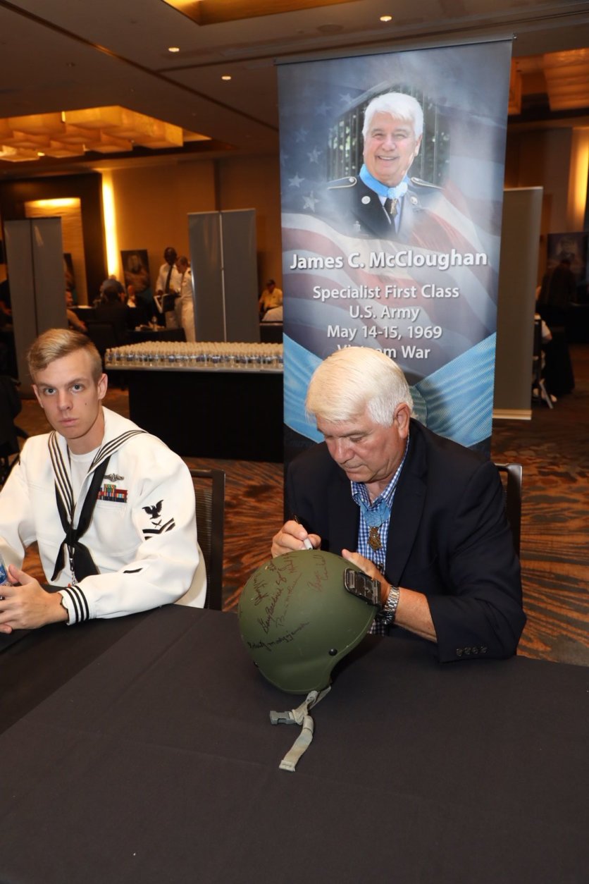 Medal of Honor recipient James McCloughan with an admirer from the Naval Academy. (Courtesy Shmulik Almany/Congressional Medal of Honor Society)