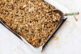 Homemade Granola in a parchment lined baking sheet, selective focus