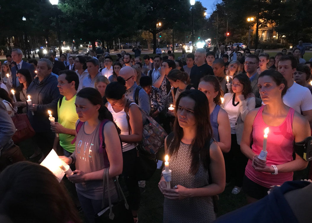 A crowd gathers in D.C.'s Logan Circle on Thursday, Sept. 20, 2018, during a vigil for Wendy Martinez, 35, who was stabbed to death while out for a run (WTOP/Michelle Basch)