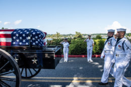 Midshipmen salute the late Sen. John McCain as a horse-drawn caisson transports his flag-draped casket to the United States Naval Academy Cemetery for his burial service, Sept. 2, 2018. John Sidney McCain, III graduated from the United States Naval Academy in 1958. He was a pilot in the United States Navy from 1958 until 1981. From 1967 to 1973 he was a prisoner of war in Vietnam. He received numerous awards, including the Silver Star, Legion of Merit, Purple Heart, and Distinguished Flying Cross. U.S. Navy photo by Mass Communication Specialist 2nd Class Nathan Burke. (Courtesy U.S. Naval Academy Public Affairs)