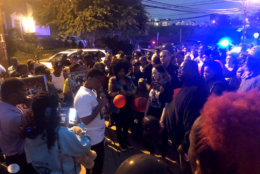 Neighbors gathered Thursday, Sept. 13, 2018, at a vigil for slain D.C. teenager TaQuan Pinkney. (WTOP/Mike Murillo)