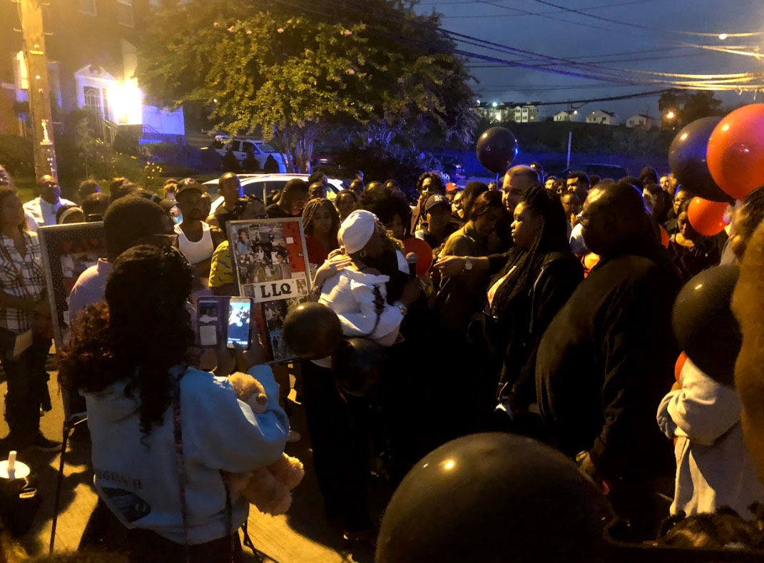 The community where slain teenager TaQuan Pinkney lived come together Thursday, Sept. 13, 2018, to bring an end to the violence which has plagued the neighborhood. (WTOP/Mike Murillo)