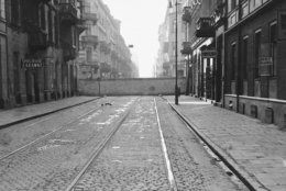 A wall of the Warsaw Ghetto cuts across a street in central Warsaw, Poland, on Dec. 20, 1940. The ghetto, built by the Nazis in 1940 as a pen for Warsaw's approximately 500,000 Jews, was enclosed by red brick and grey stone walls more than 10 feet high, topped with barbed wire, and enclosing an area of about 1.3 square miles (3.4 square km), roughly the size New York's Central Park. (AP Photo/Alvin Steinkopf)