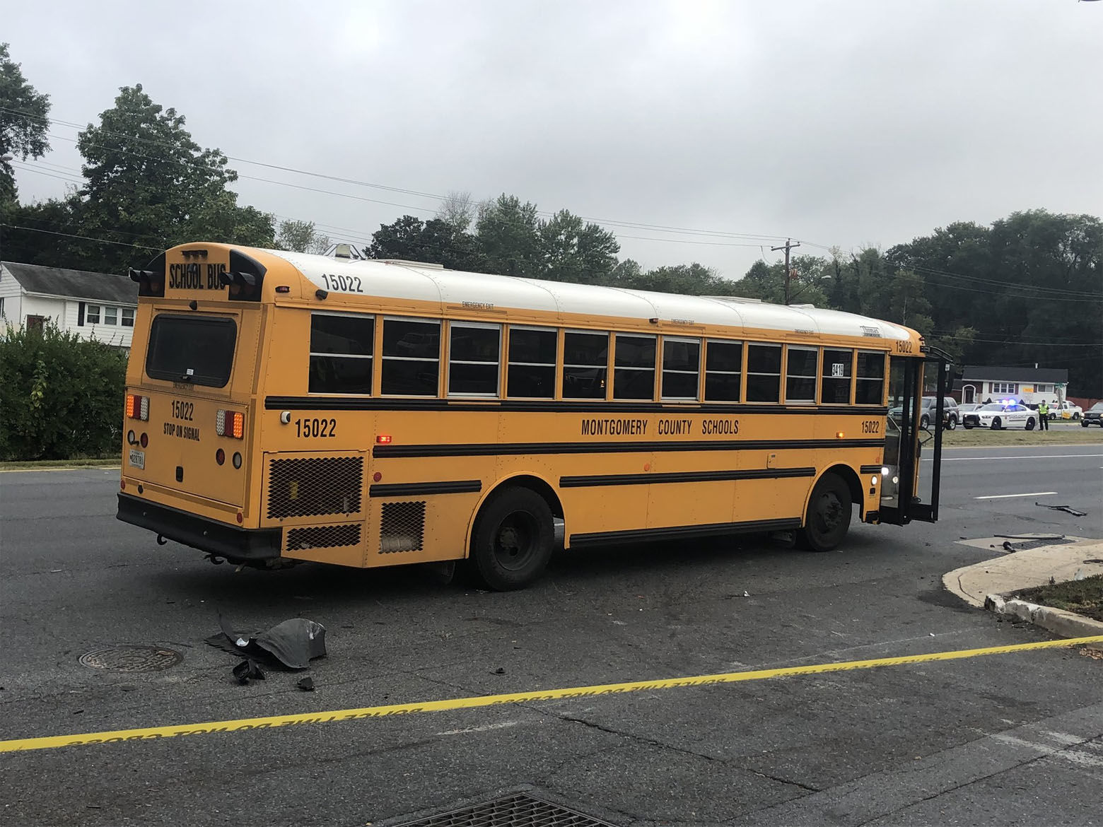 Four Kennedy High School students waiting for a school bus in Aspen Hill, Maryland, Tuesday morning were struck by a car that careened onto the sidewalk off Georgia Avenue. (WTOP/Melissa Howell)