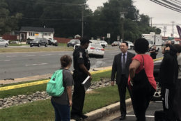 Four Kennedy High School students waiting for a school bus in Aspen Hill, Maryland, Tuesday morning were struck by a car that careened onto the sidewalk off Georgia Avenue. (WTOP/Melissa Howell)