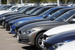In this Thursday, Aug. 30, 2018, photograph, a long line of 3 series sedans sits at a BMW dealership in Highlands Ranch, Colo. (AP Photo/David Zalubowski)