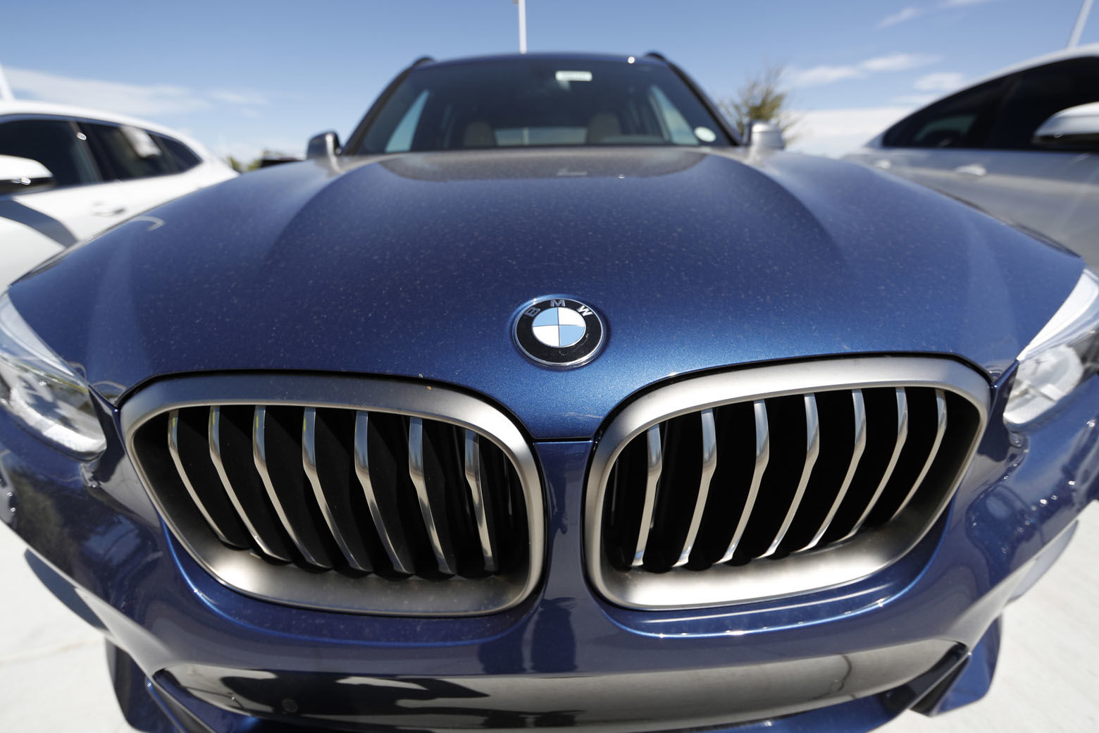 In this Thursday, Aug. 30, 2018, photograph, the nose of a an unsold 2018 X3 sports utility vehicle is shown at a BMW dealership in Highlands Ranch, Colo. (AP Photo/David Zalubowski)