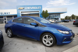 In this Sunday, June 24, 2018, photograph, an unsold 2018 Volt sits in front of a Chevrolet dealership in Englewood, Colo. (AP Photo/David Zalubowski)