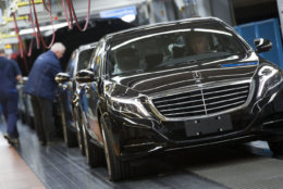 In this Jan. 28, 2015 picture an employee of the Mercedes-Benz AG checks a S-Class model at the plant in Sindelfingen, Germany. Daimler will present its second quarter earning Thursday, July 23, 2015.  (AP Photo/Matthias Schrader)