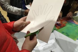 “We had the idea of having people trace their hand prints to both show that they were here in solidarity and to represent the community as a whole,” said Sarah Berry, Cultural Arts Director of the JCC. (WTOP/Liz Anderson)