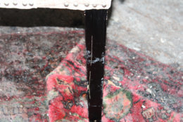 This close-up of a chair leg shows duct tape residue where the victims were restrained while they were held captive inside the Savopoulos family's house for nearly 24 hours. (U.S. Attorney's Office for D.C.)
