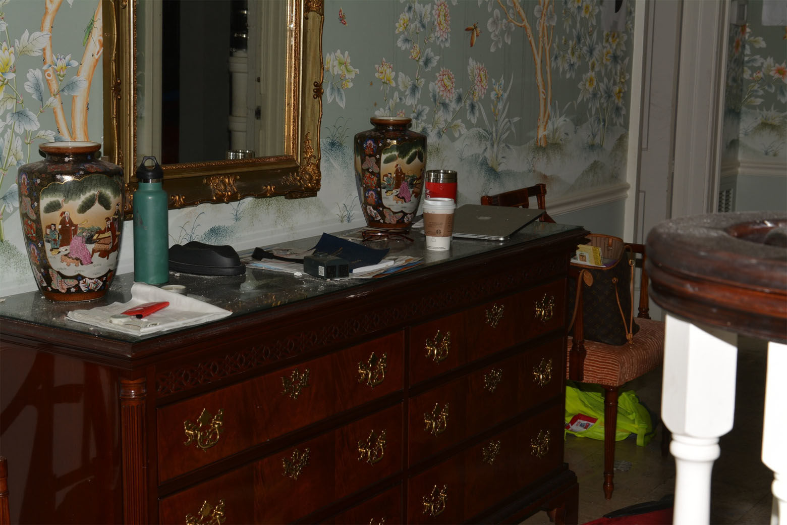 Prosecutors said Amy Savopoulos was out on a Starbucks run when Daron Wint got inside the house. When she returned home, he took her captive alongside her son and Vera Figueroa, one of the family's housekeepers. A Starbucks cup is seen on a bureau in the home's entryway. (Courtesy U.S. Attorney's Office for D.C.)