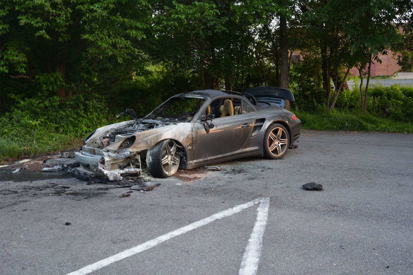 The blue Porsche belonging to Amy Savopoulos was driven from the family's house after the mansion was set ablaze. It was later found burning in the back of a church parking lot in New Carrollton, Maryland. Inside, investigators found a construction vest with Daron Wint's DNA on it. (Courtesy U.S. Attorney's Office for D.C.)