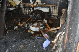 The samurai sword perched on the toilet seat in the bathroom next to the burned-out bedroom. Investigators couldn't recover any forensic evidence from the knife blade. Extreme heat destroys DNA evidence. But investigators found blood -- belonging to Philip Savopoulos -- on a tassel on the handle. (Courtesy U.S. Attorney's Office for D.C.)