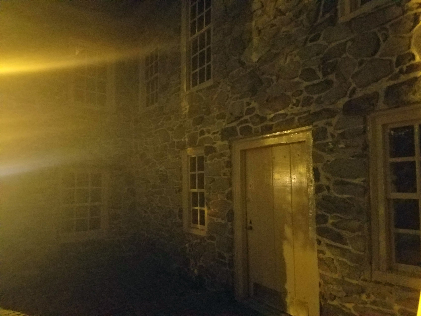 The Old Stone House at night is not a welcoming sight. (WTOP/Will VItka)