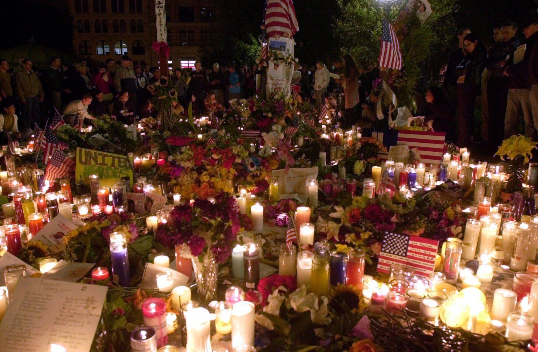 A candlelight vigil and memorial continues early Saturday morning, Sept. 15, 2001 on New York's Union Square, not far from the site of Tuesday's terrorist attack against the World Trade Center. With the area surrounding the World Trade Center still sealed off, Union Square has become a gathering place for people honoring victims of the attack. (AP Photo/Mark Lennihan)
