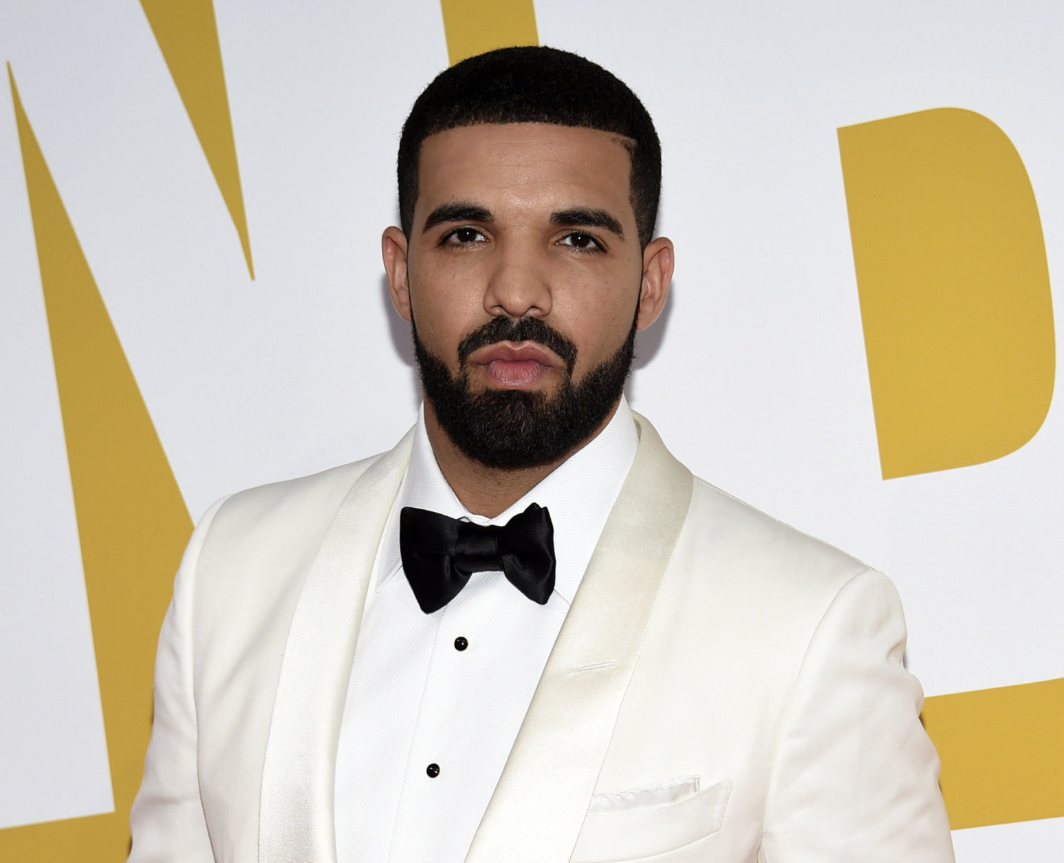 FILE - In this June 26, 2017, file photo, Canadian rapper Drake arrives at the NBA Awards in New York. Drake is going on tour. He announced the Aubrey and The Three Amigos tour on Monday, May 14, 2018. Drake will be joined by “Walk It Talk It” collaborators Migos and special guests on the North American leg through the summer and fall. (Photo by Evan Agostini/Invision/AP, File)