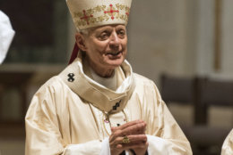 Cardinal Donald Wuerl, Archbishop of Washington, conducts Mass at St. Mathews Cathedral, Wednesday, August 15, 2018 in Washington. (AP Photo/Kevin Wolf)