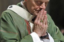  In this Wednesday, Oct. 20, 2010 file photo, Archbishop Donald Wuerl prays as he celebrates Mass at the Cathedral of Saint Matthew the Apostle in Washington. On Tuesday, Aug. 14, 2018, a Pennsylvania grand jury accused Cardinal Wuerl of helping to protect abusive priests when he was Pittsburgh's bishop. (AP Photo/Alex Brandon)