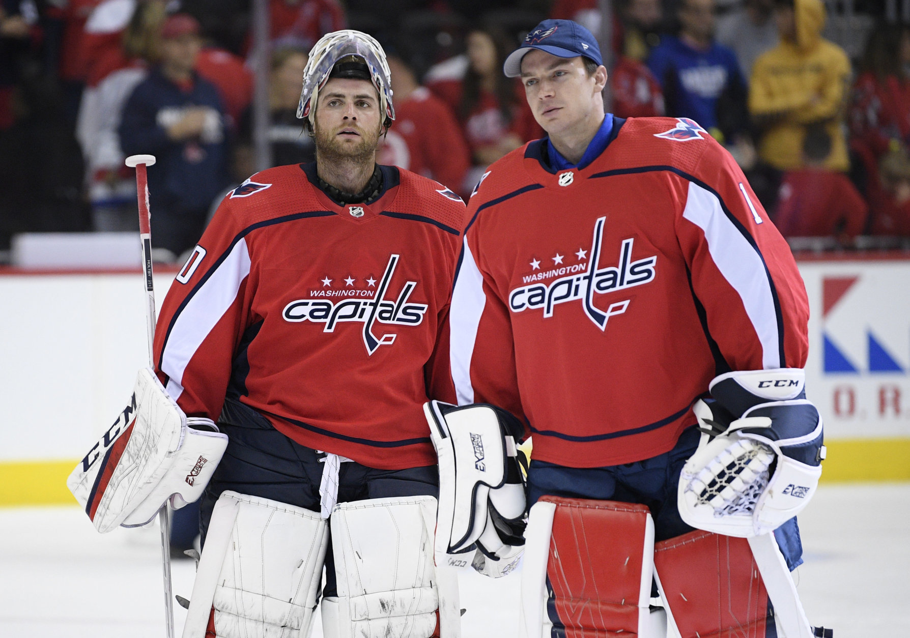 Washington Capitals goaltenders Braden Holtby, left, and Pheonix Copley, right, leave the ice after an NHL preseason hockey game against the St. Louis Blues, Sunday, Sept. 30, 2018, in Washington. The Capitals won 5-2. (AP Photo/Nick Wass)