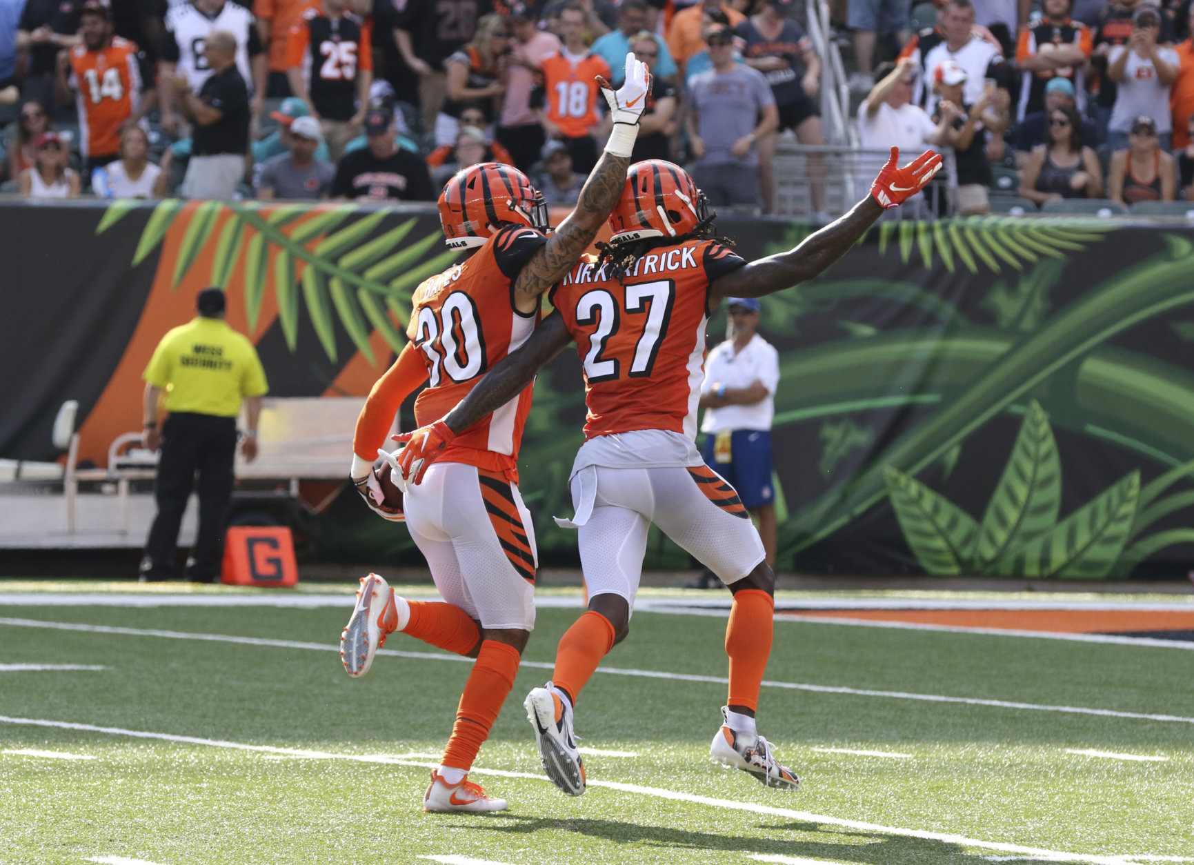 Cincinnati Bengals free safety Jessie Bates (30) celebrates an interception with cornerback Dre Kirkpatrick (27) during the second half of an NFL football game against the Miami Dolphins in Cincinnati, Sunday, Oct. 7, 2018. The Bengals defeated the Dolphins 27-17. (AP Photo/Gary Landers)
