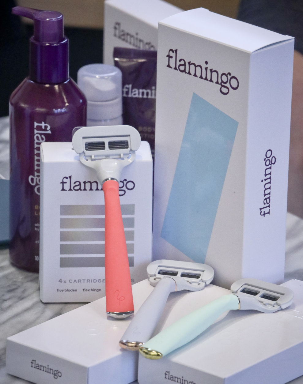 In this Thursday, Oct. 11, 2018, photo products from Harry's new shaving and body care brand Flamingo are displayed in New York. Flamingo, which launches Tuesday, Oct. 16, is a new direct-to-consumer hair removal and body care brand for women that aims to make women less uncomfortable about shaving. “This category has been historically very taboo,” said Allie Melnick, the general manager for Flamingo. (AP Photo/Bebeto Matthews)