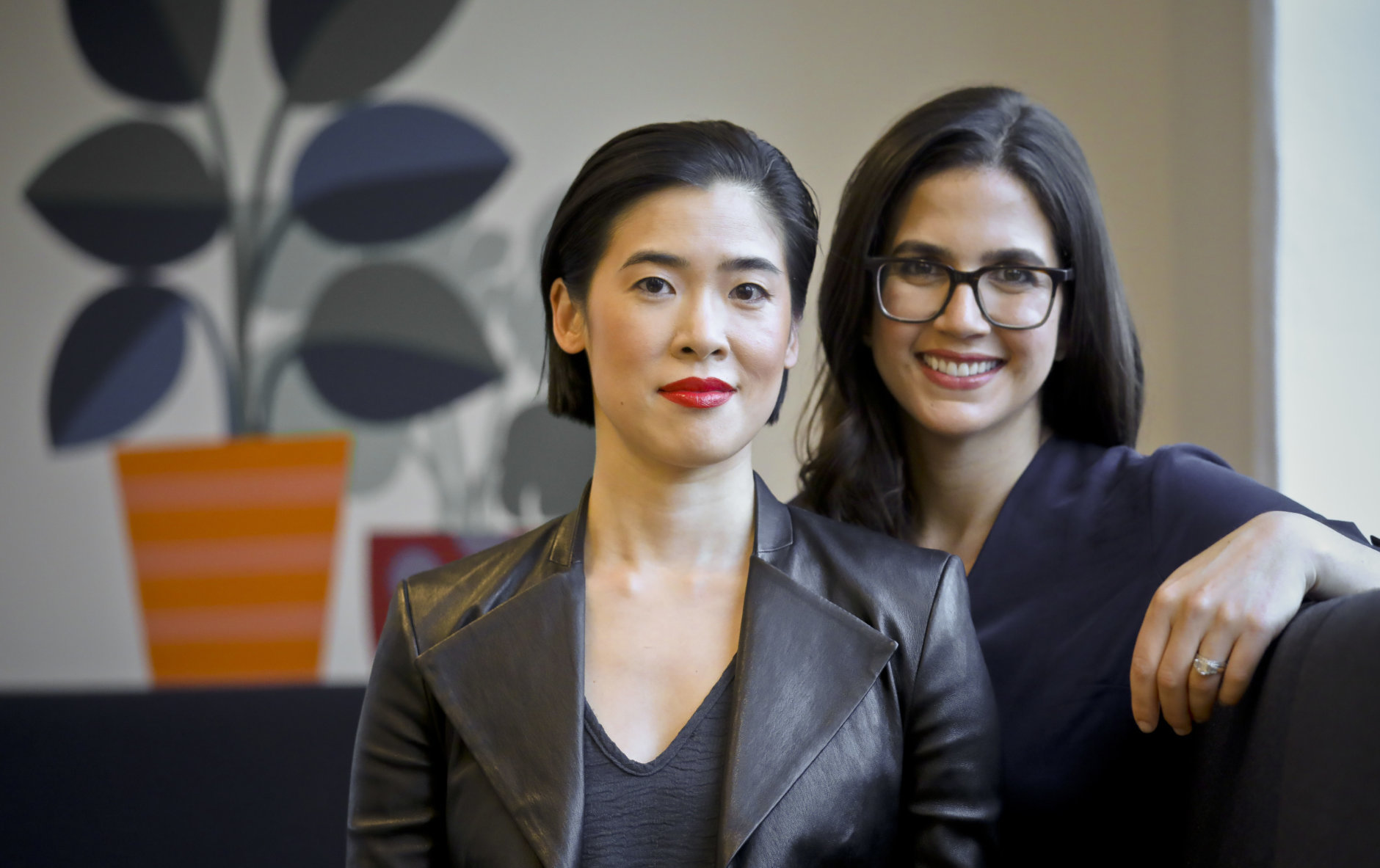 In this Thursday, Oct. 11, 2018, photo Brittania Boey, left, and Allie Melnick, right, leaders behind Harry's new shaving and body care brand Flamingo pose for a photo in New York. The company behind men’s shaving brand Harry’s is launching Flamingo, a new direct-to-consumer hair removal and body care brand for women, that aims to make women less uncomfortable about shaving. (AP Photo/Bebeto Matthews)
