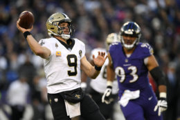 New Orleans Saints quarterback Drew Brees (9) prepares to throw to a receiver in the second half of an NFL football game against the Baltimore Ravens, Sunday, Oct. 21, 2018, in Baltimore. (AP Photo/Nick Wass)