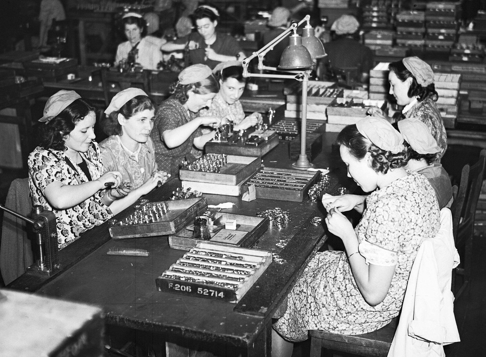 Female workers in a British armament factory,  somewhere in England, May 26, 1940, working on their Sunday off. Workers all over Britain have been working twelve hours a day and seven days a week in response to an appeal by the Minister of Supply, Herbert Morrison, to increase productivity. (AP Photo/Staff/Leslie Priest)