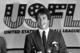 University of Miami quarterback Jim Kelly is all smiles at his press conference, Thursday, June 10, 1983 after signing a multi-year contract with the new USFL franchise, the Houston Gamblers. His college teammate running back Mark Rush also signed with the Gamblers. Both were drafted by NFL clubs. (AP Photo/F. Carter Smith)