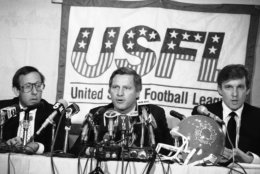 New York real estate magnates Stephen Ross, left, and Donald Trump, right, speak about the agreement they have reached in principle to merge the Houston Gamblers and New Jersey Generals football franchises, Thursday, August 2, 1985 in New York. USFL Commissioner Harry L. Usher, center announced the agreement. (AP Photo/Marty Lederhandler)