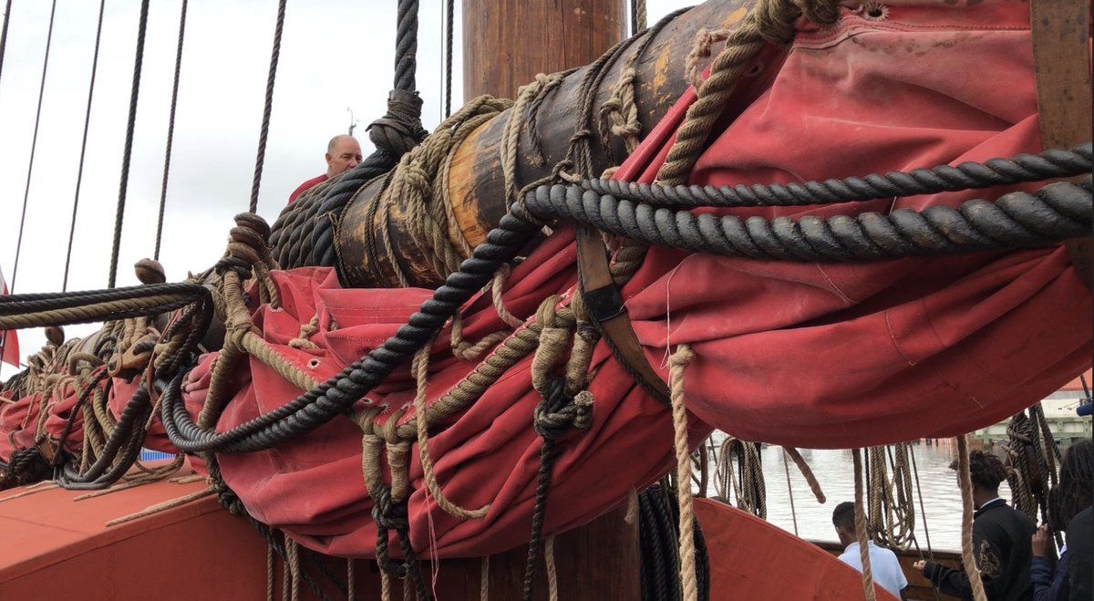 When the Draken came up the Potomac River to dock on the Southwest D.C. waterfront, the wind was coming from the wrong direction for its bright crimson sail to be unfurled. (WTOP/Kristi King)