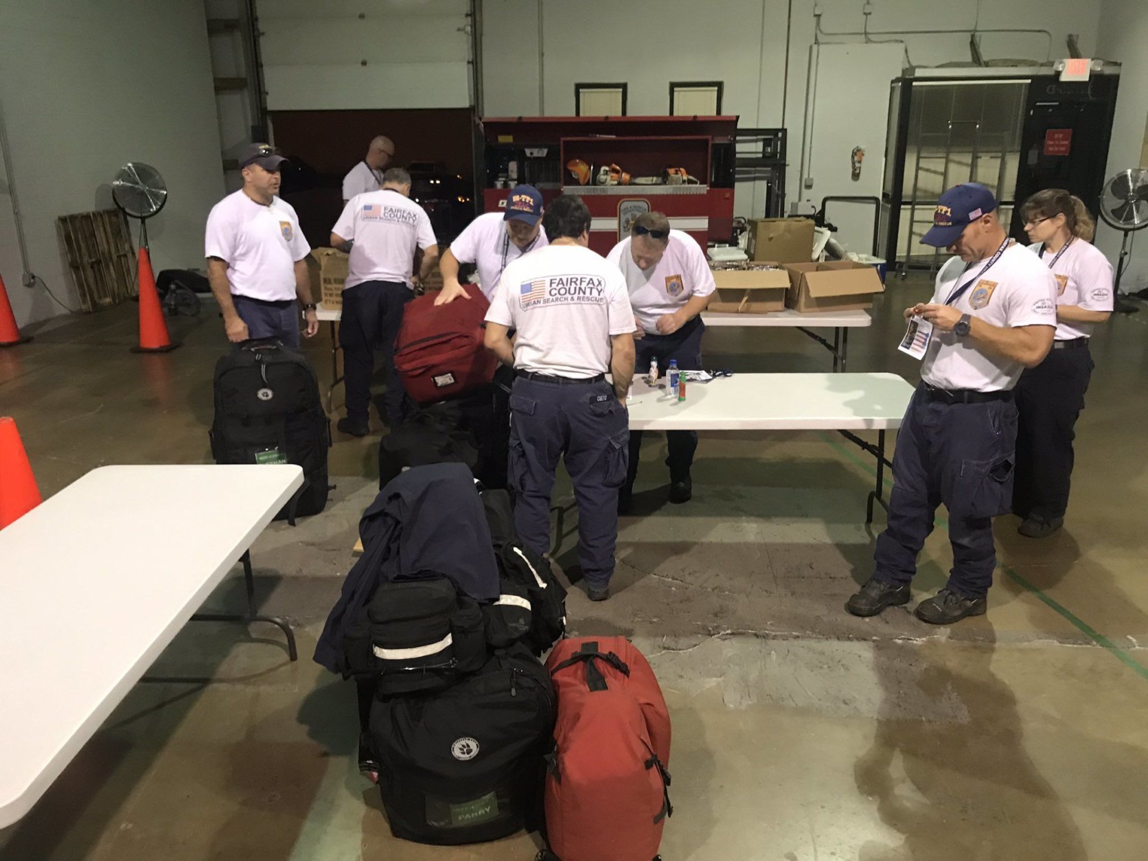 In Fairfax County, Virginia, two teams — each with 17 search and rescue personnel — readied for deployment early Tuesday. (WTOP/Neal Augenstein)