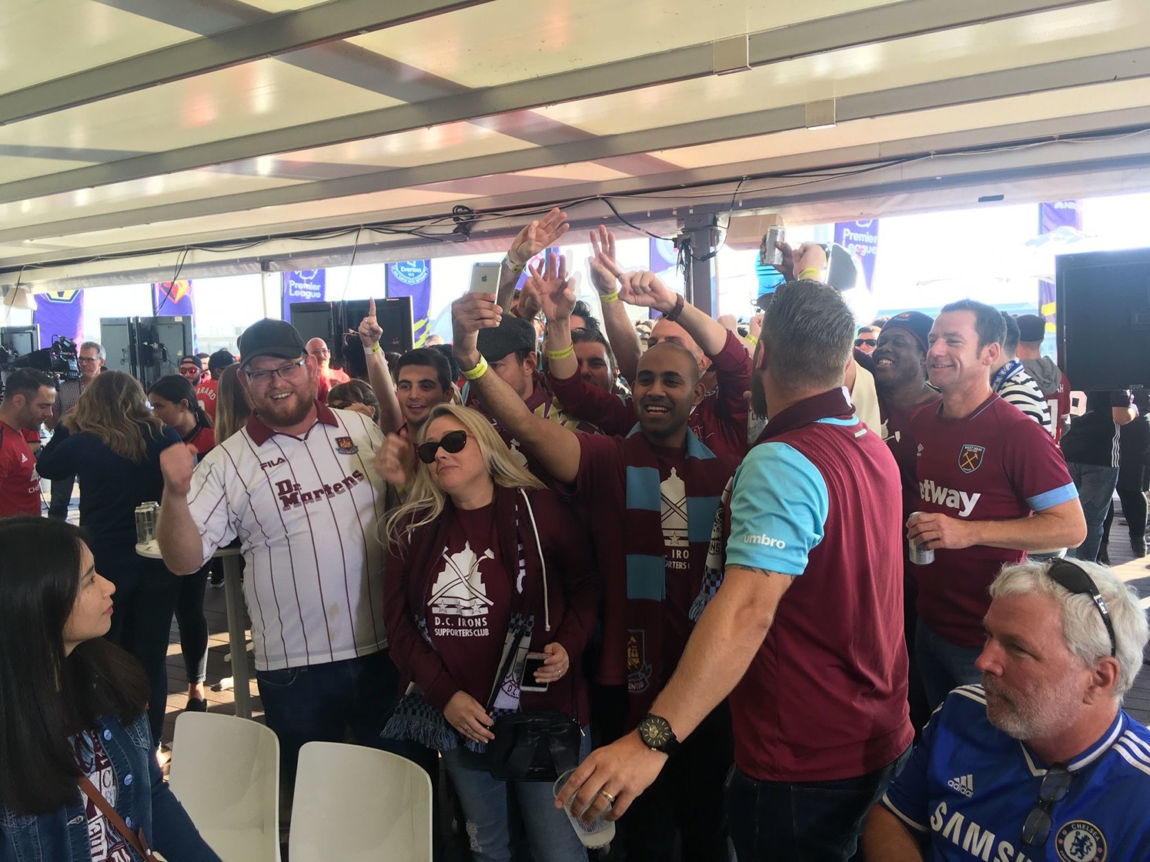 A group of West Ham fans celebrate their upset win over Manchester United at the Premier League Fanfest at Capitol View. (WTOP/Noah Frank)