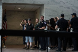 WASHINGTON, DC - OCTOBER 04:  Comedian Amy Schumer (C) waits to be led away after being arrested during a protest against the confirmation of Supreme Court nominee Judge Brett Kavanaugh October 4, 2018 at the Hart Senate Office Building on Capitol Hill in Washington, DC. Senators had an opportunity to review a new FBI background investigation into accusations of sexual assault against Kavanaugh and Republican leaders are moving to have a vote on his confirmation this weekend. (Photo by Alex Wong/Getty Images)