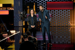 LOS ANGELES, CA - OCTOBER 09:  Sara Gilbert and Thomas Rhett speak onstage during the 2018 American Music Awards at Microsoft Theater on October 9, 2018 in Los Angeles, California.  (Photo by Kevin Winter/Getty Images For dcp)