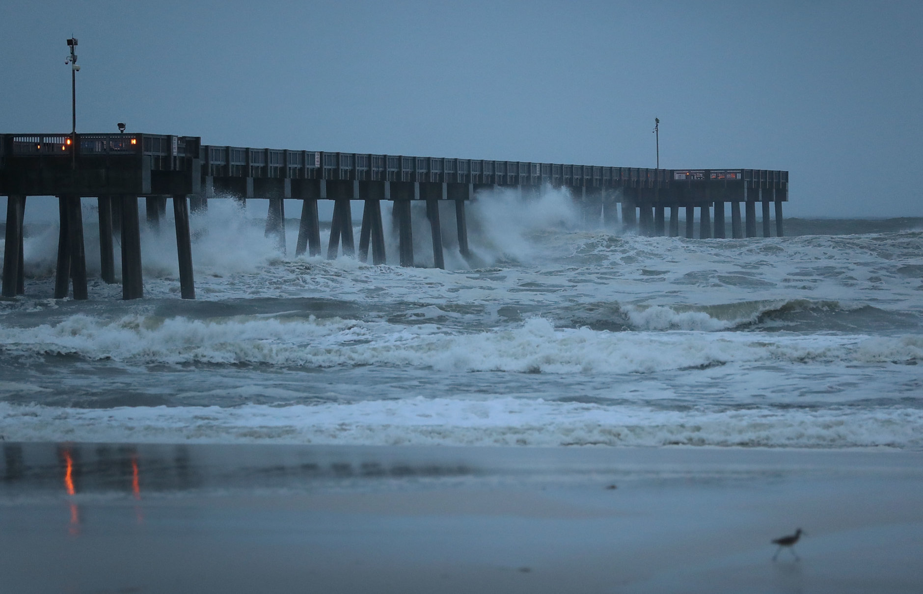 PANAMA CITY BEACH, FL - OCTOBER 10:  Waves crash along a pier as the outerbands of  hurricane Michael arrive on October 10, 2018 in Panama City Beach, Florida. The hurricane is forecast to hit the Florida Panhandle at a possible category 4 storm.  (Photo by Joe Raedle/Getty Images)