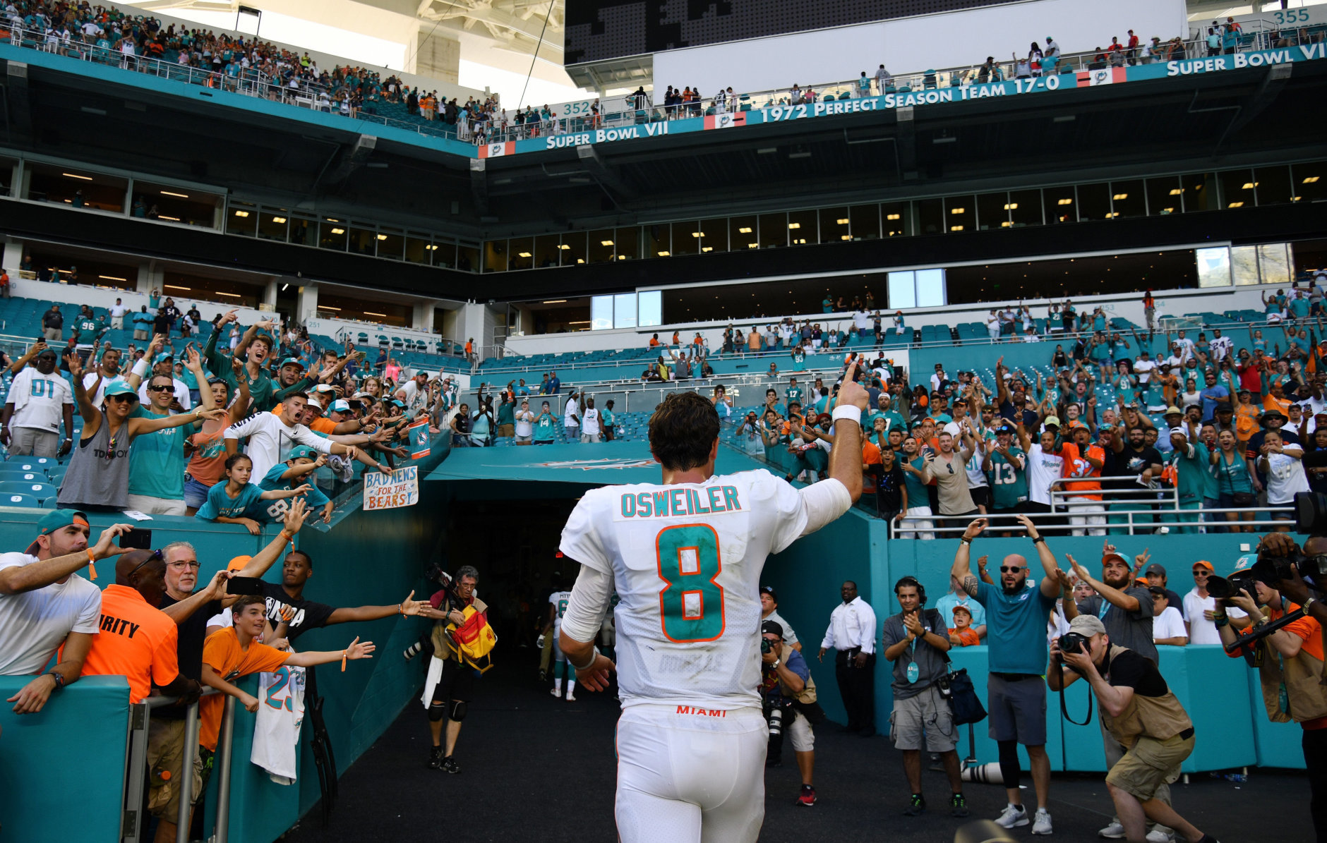 MIAMI, FL - OCTOBER 14:  Brock Osweiler #8 of the Miami Dolphins celebrates as he walks off of the field after the Dolphins defeated the Bears 31 to 28 of the game at Hard Rock Stadium on October 14, 2018 in Miami, Florida.  (Photo by Mark Brown/Getty Images)