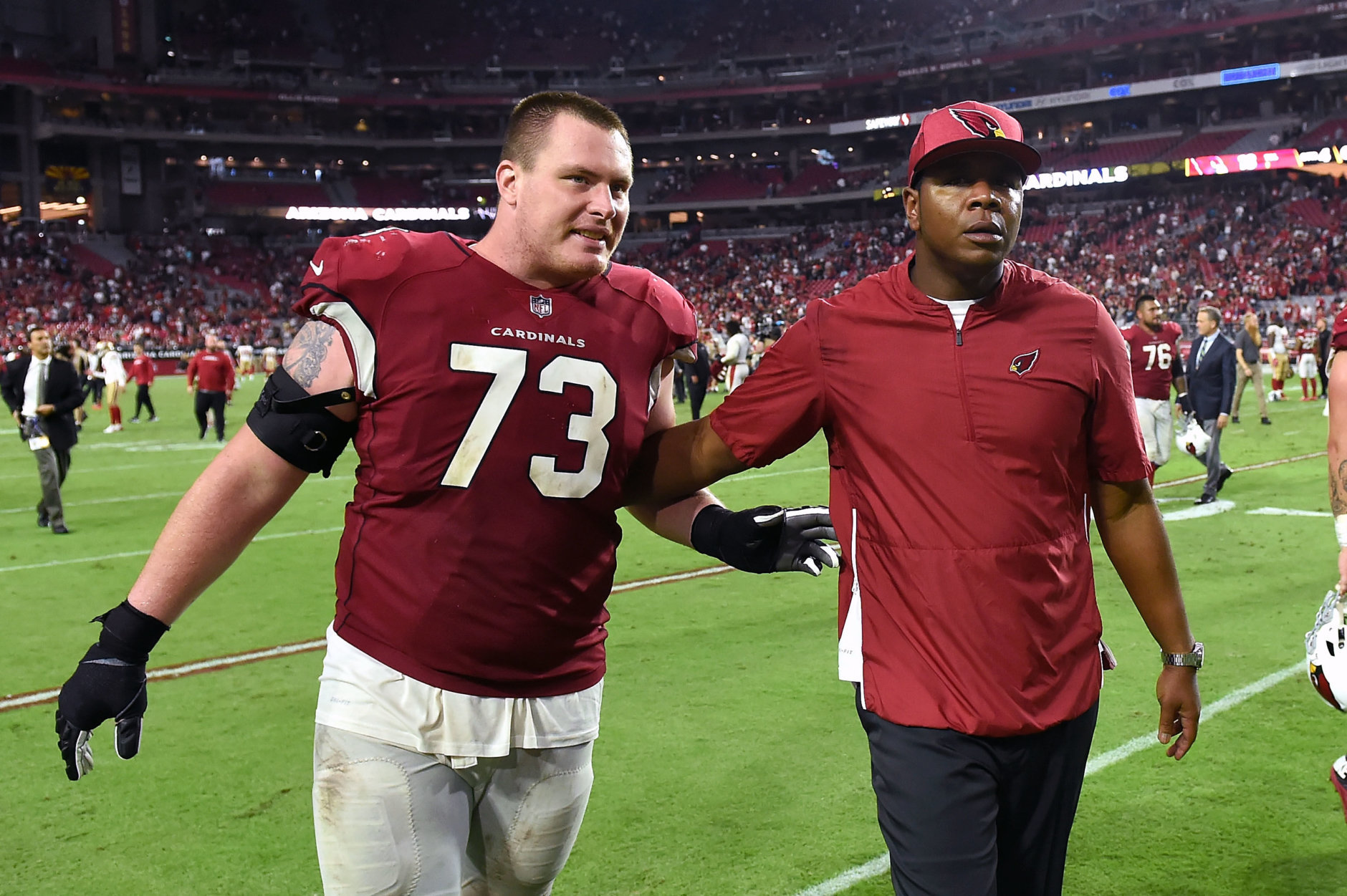 GLENDALE, AZ - OCTOBER 28:  Offensive coordinator Byron Leftwich and offensive guard John Wetzel #73 of the Arizona Cardinals walk off the field after the Cardinals beat the San Francisco 49ers 18-15 at State Farm Stadium on October 28, 2018 in Glendale, Arizona.  (Photo by Norm Hall/Getty Images)