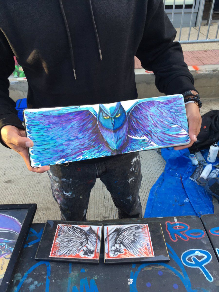 An artist displays his work at this year's H Street Festival. (WTOP/Liz Anderson)