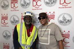 Barry Harrison, of Clark Construction, helped tear down a fence and build and widen a road for DC Fire equipment at the Arthur Capper Senior Apartments fire. "It was gratifying just to be able to help them," Harrison said. He met resident Robert Sparrow while working nearby. (WTOP/Kristi King)